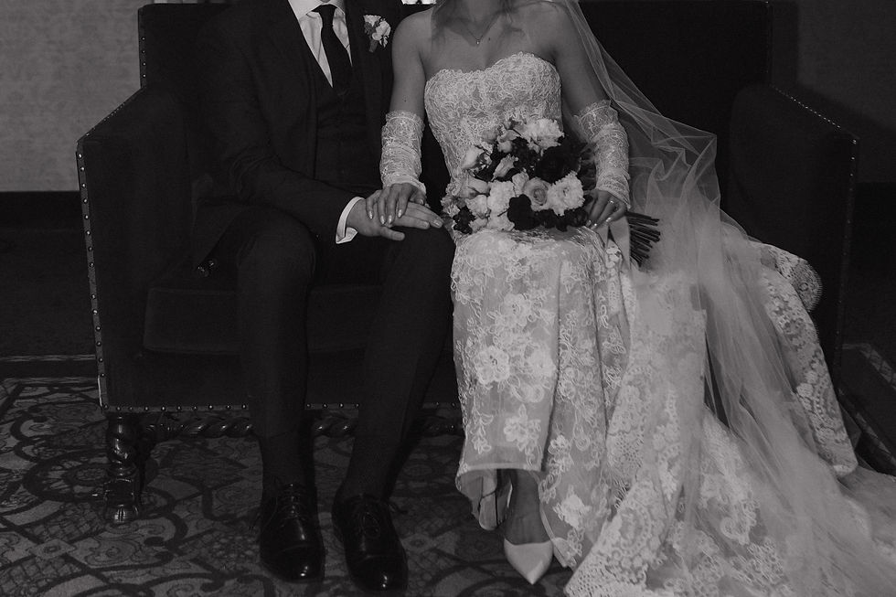 Close up photo of a wedding couple sitting close