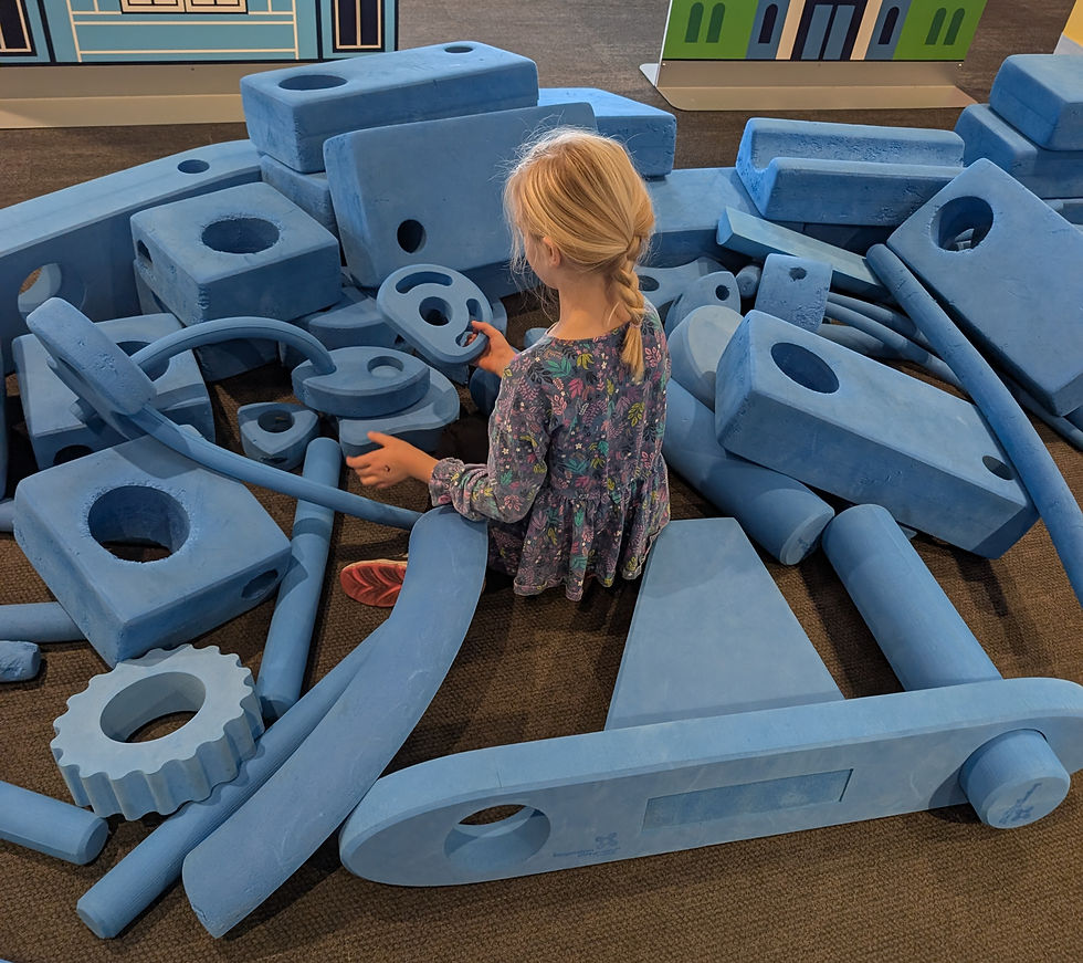 Child playing with oversized blocks