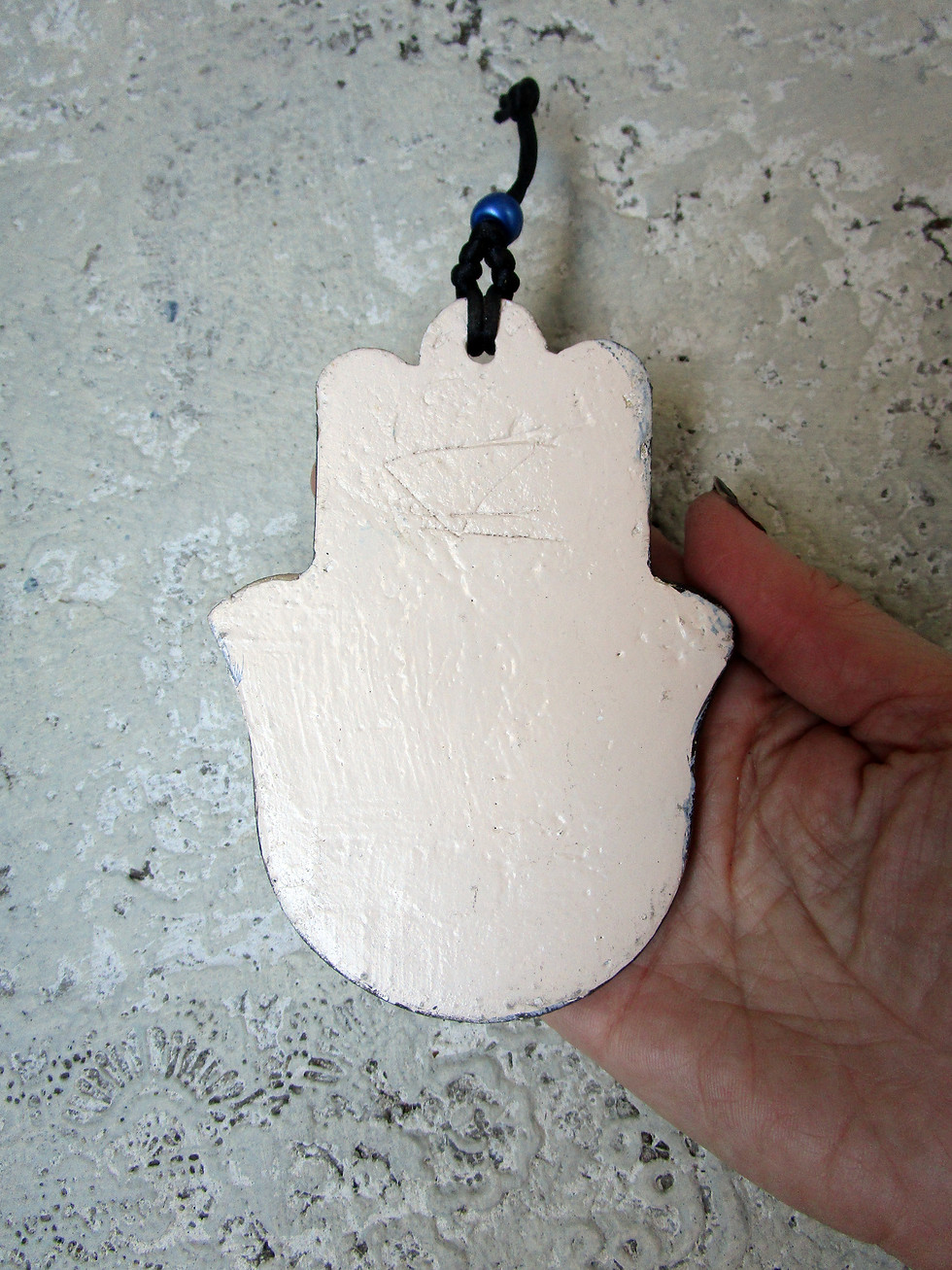 Thumbnail: ceramic red textured hamsa wall hanging.