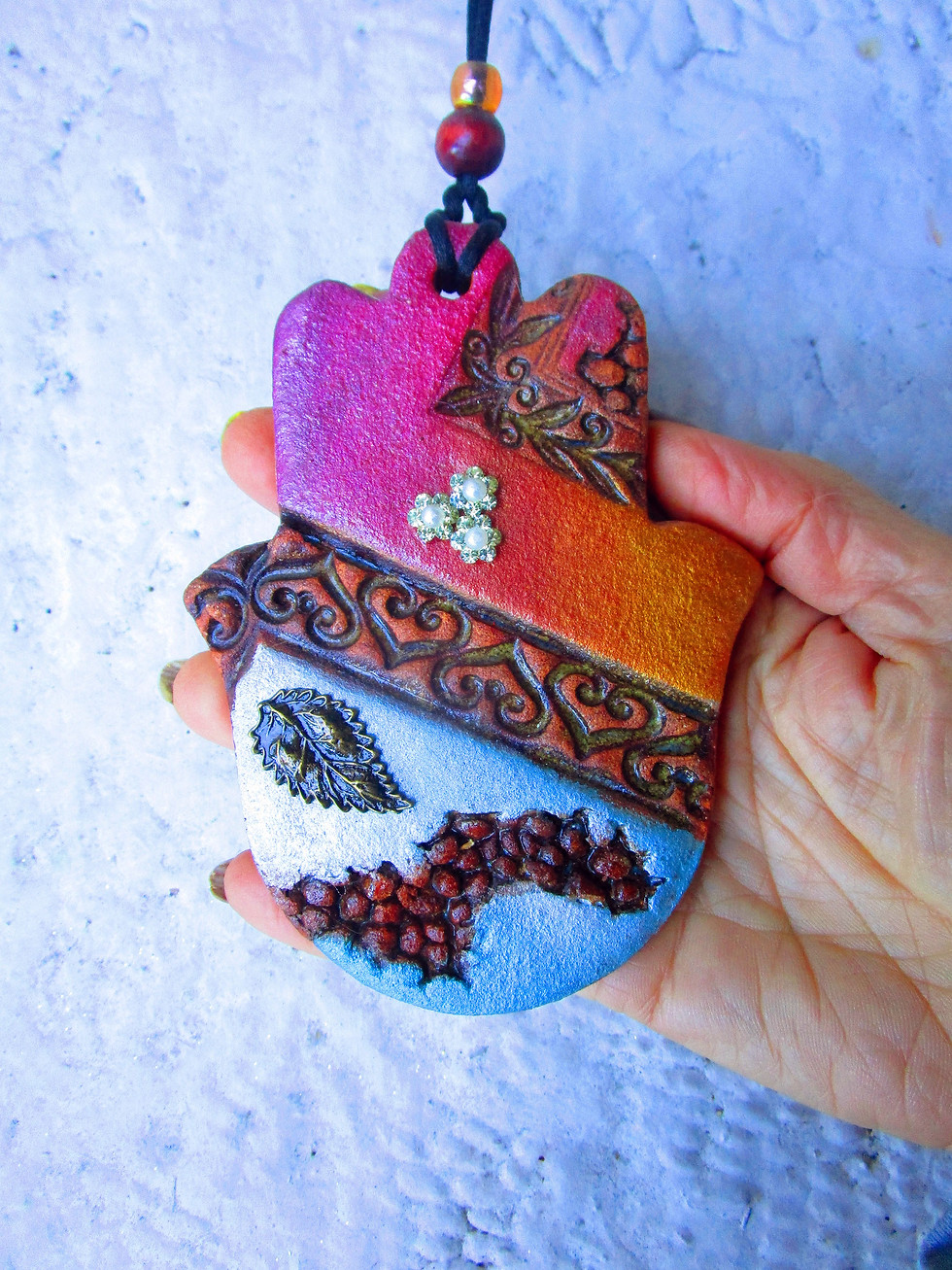 Thumbnail: ceramic colorful hamsa wall hanging.