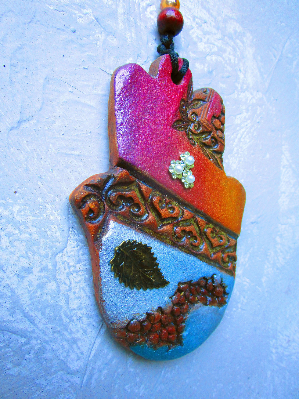 Thumbnail: ceramic colorful hamsa wall hanging.