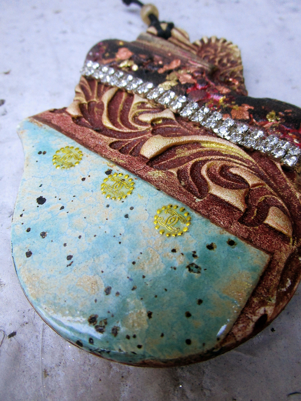 Thumbnail: ceramic textured hamsa with crystal chain.