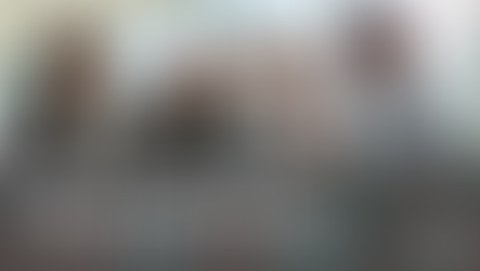 Four marketing team members around a table talking about marketing strategy