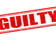 Red stamped GUILTY in bold distressed letters on a white background, tilted diagonally like an official verdict stamp.