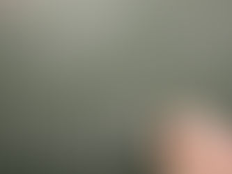 Hand writing "I will not" and "I will" on a green chalkboard with white chalk. 