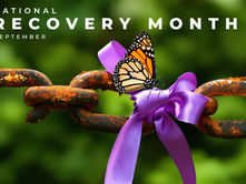 Monarch butterfly on a purple ribbon tied to a rusty chain, with National Recovery Month September text on a green background.