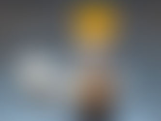 Orange prescription bottle labeled for daily use with two white pills against a light blue background.