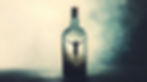 A person stuck in a bottle is trying to climb out.