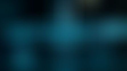 A syringe with blue liquid, needle tip down, glows against a dark background with the word "TRANQ" overlaid, a nickname for the drug Xylazine.