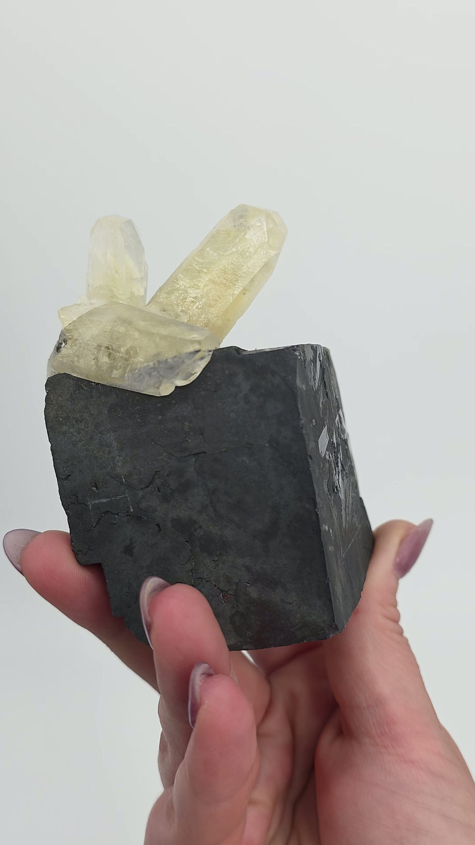 Thumbnail: Spunky Golden Calcite On Huge Silver Metallic Galena Crystal