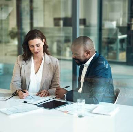 Consultants discussing digital finance innovation in office
