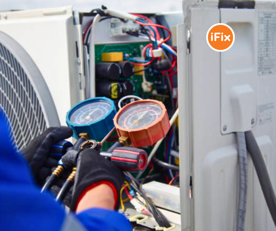 A gloved technician using refrigerant pressure gauges to service an open air conditioning unit, with the iFix logo in the upper right corner.