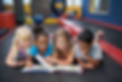 Children reading together in play gym.png