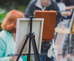 Process of plein air painting, group class of adult talented students in the park with pai