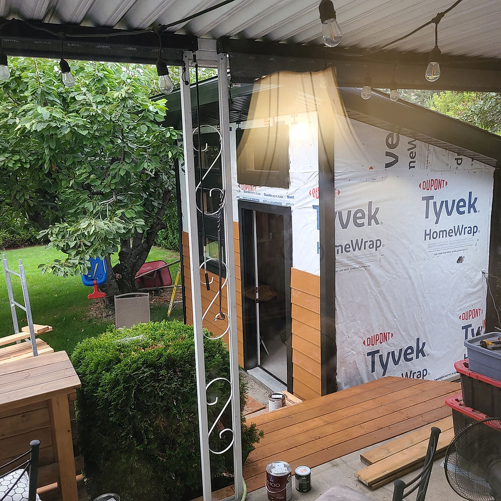 Backyard shed under construction with Tyvek wrap in a Kelowna backyard