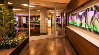 Healthcare waiting area featuring illuminated relief wall panels at Platinum Medical Center