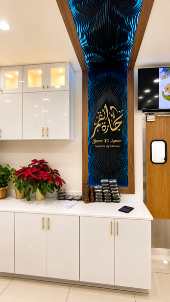 Custom illuminated CNC relief counter and sculptural ceiling feature at Jaret El Amar Sweets designed by RILIEVO.