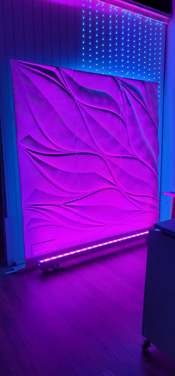 Backlit relief reception desk and feature wall at SkinMD MedSpa designed by RILIEVO.