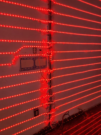 Illuminated sculptural relief wall installation inside Blu Lounge.