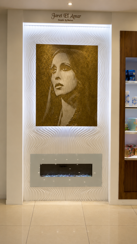 Custom illuminated CNC relief counter and sculptural ceiling feature at Jaret El Amar Sweets designed by RILIEVO.