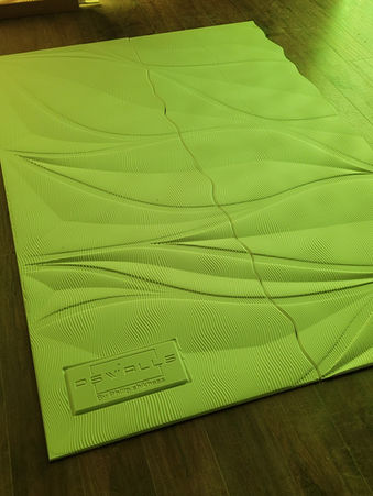 Assembly and finishing of Rilievo 3D panels before installation in clinic reception area