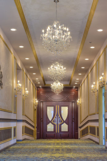 Decorative CNC relief panels integrated into a luxury banquet hall bar designed by RILIEVO.