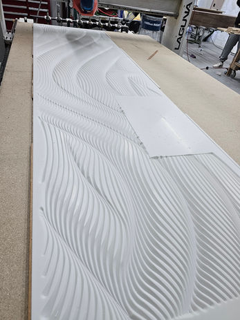Perspective view of sculptural illuminated relief fireplace wall at Tuscan Café.