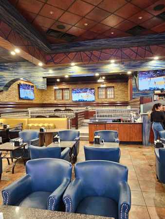 Custom Rilievo CNC carved wall panels integrated in a modern café interior design in Michigan, featuring 3D architectural surfaces and ambient lighting , before image 1