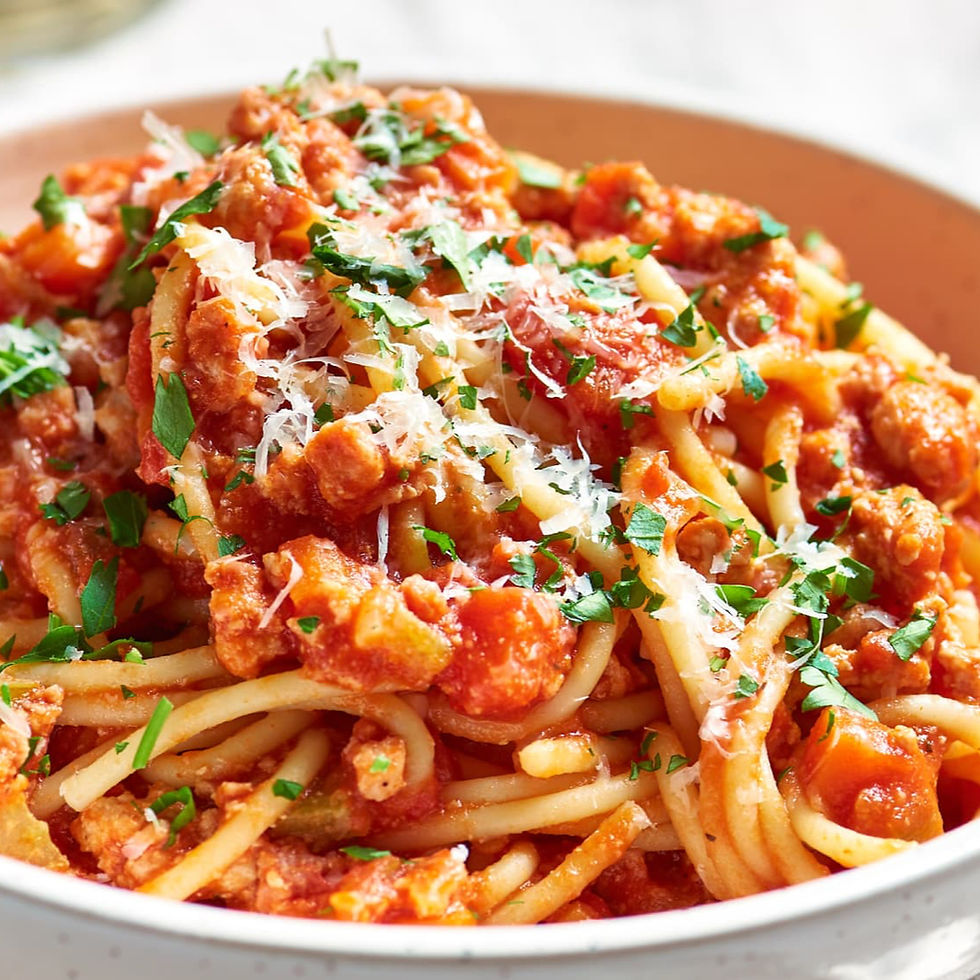 Close-up view of a colorful plate of turkey spaghetti with meatballs