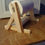 Thumbnail: Wooden toilet paper holder with a roll on a wooden table