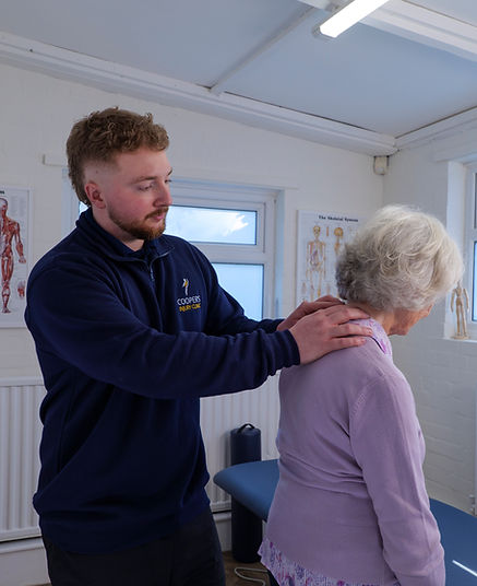 The owner of a MSK clinic assessing a lady who has complaints of neck pain