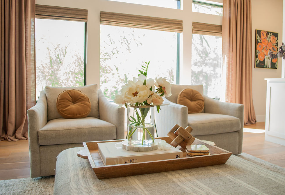 Eye-level view of a cozy living room with classic wood furniture and neutral walls