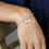Thumbnail: Faux gold and silver plated double star bracelet with shell inlay from Peace of MInd