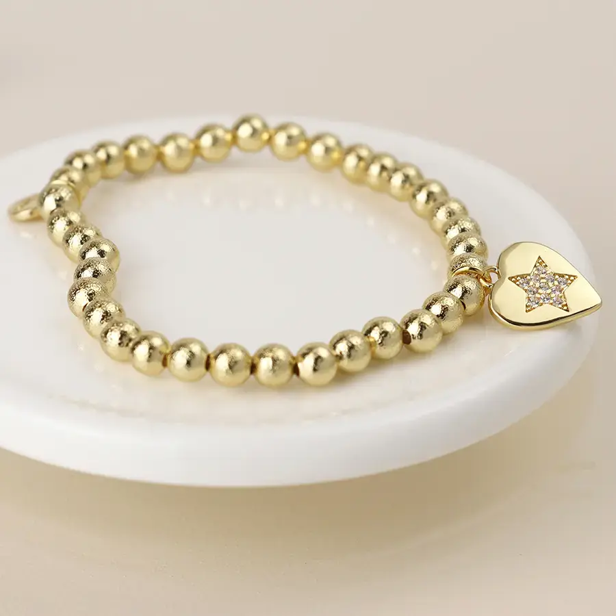 Thumbnail: Golden beaded heart charm bracelet with pave crystal star