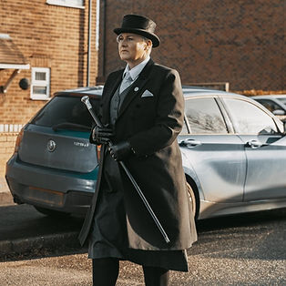 Helen walking with hearse