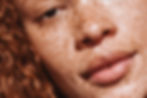Chica Bloom Black woman with freckles close up