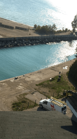 A top view of the RKS Electric (2015) Inc service van on a waterfront property