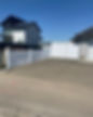 An image of a fenced area outside of a home