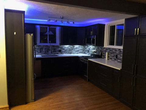 An image of a modular kitchen with ceiling lights