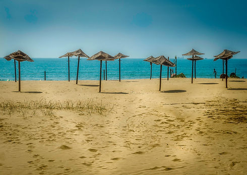 stock-photo-umbrella-in-the-beach-97870751.jpg