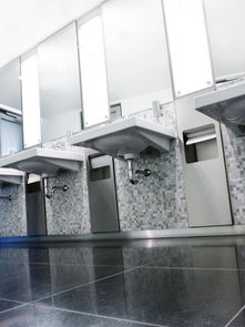 Modern public restroom with integrated paper dispensers, ideal for IoT based hygiene monitoring