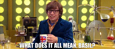 Austin Powers holding Union Jack mug, looking confused in a lab with chemistry glassware. Text reads: "WHAT DOES IT ALL MEAN, BASIL?"