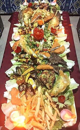 Shared dining dish with Tunisian specialities and seafood for up to six guests at Restaurant Djerba Lina.
