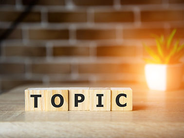 Letter block in word topic on brick background..jpg