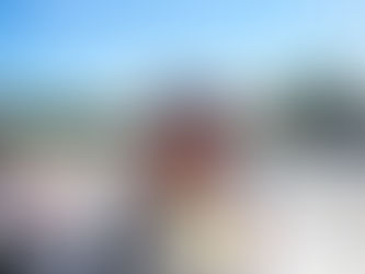 Ted Giovanis at the racetrack analyzing performance, representing racing data analysis and post-race evaluation.