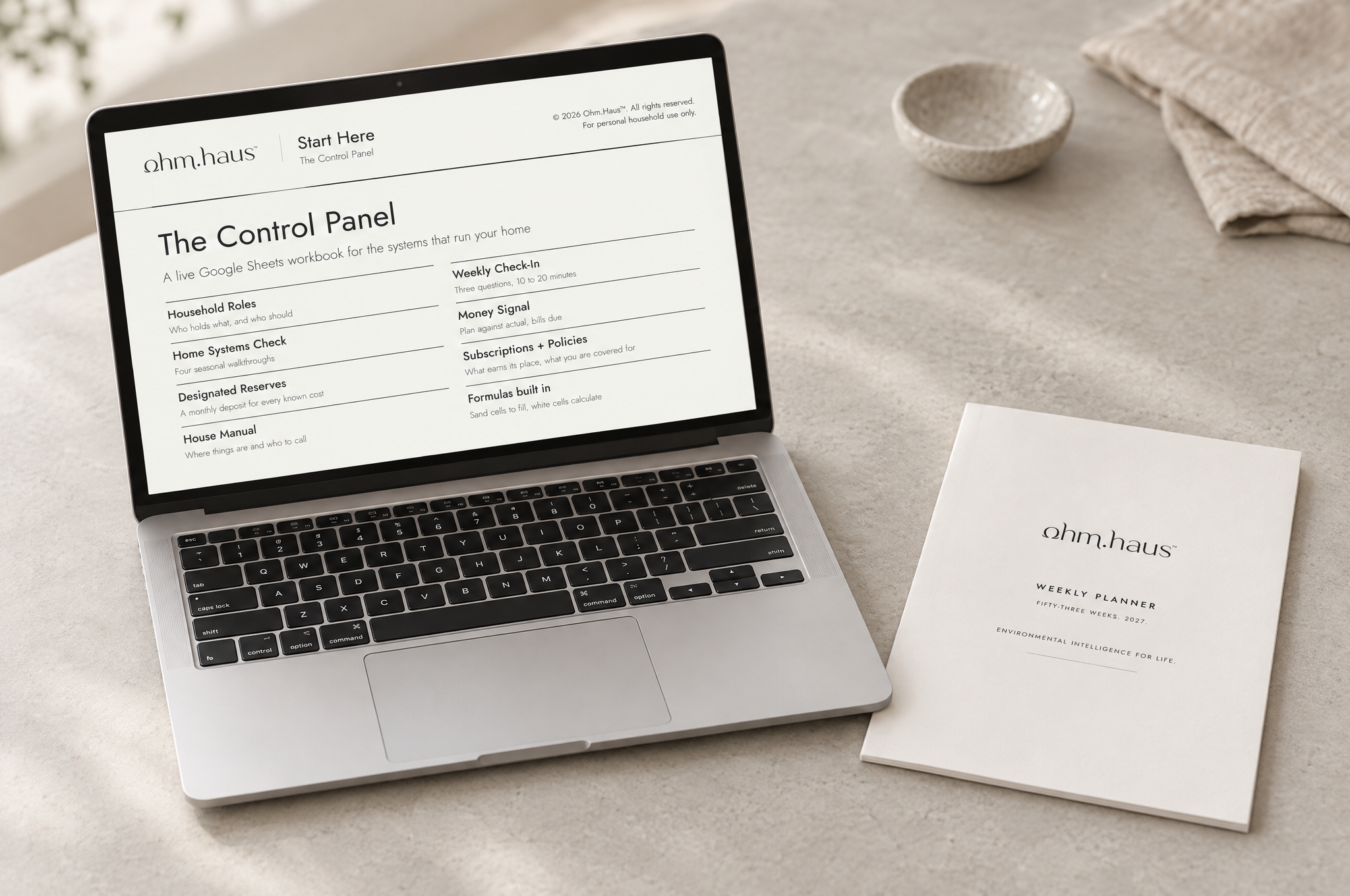 The Control Panel household workbook open on a laptop