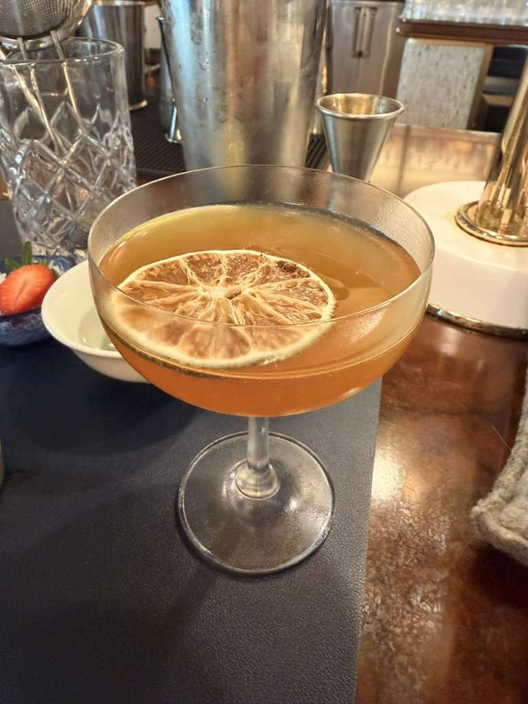 A finished cocktail in a coupe at the Pour Decisions class