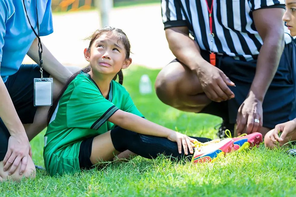 Little girl gets hurt playing soccer and looks to her coach for support