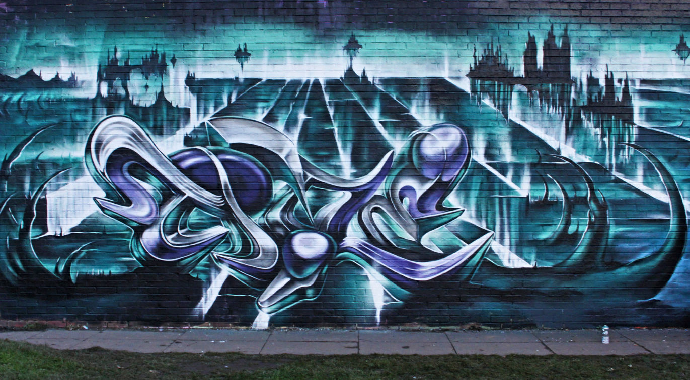 An emerald and purple coloured piece of graffiti with an amazing background