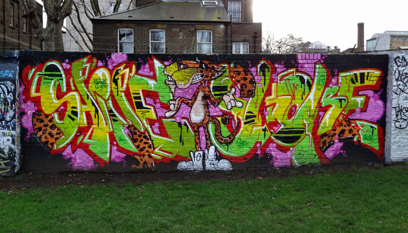 Graffiti wall spray painted in London featuring a character of a tiger